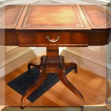 F21. Leather topped side table.  29&rdquo;h x 35&rdquo;w x 23&rdquo;d  